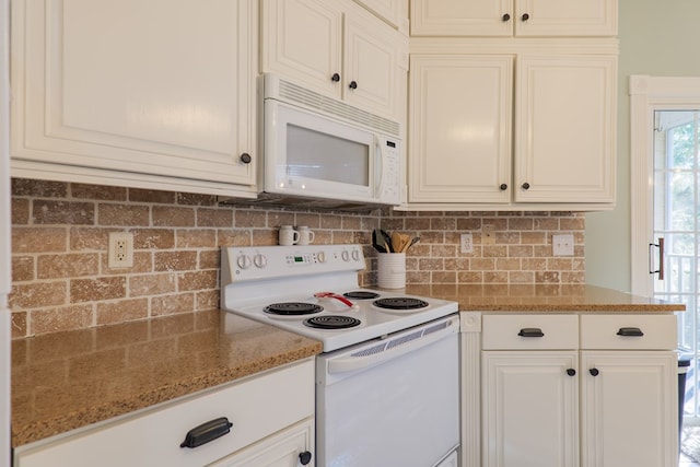 kitchen with light stone countertops, white appliances, white cabinetry, and backsplash