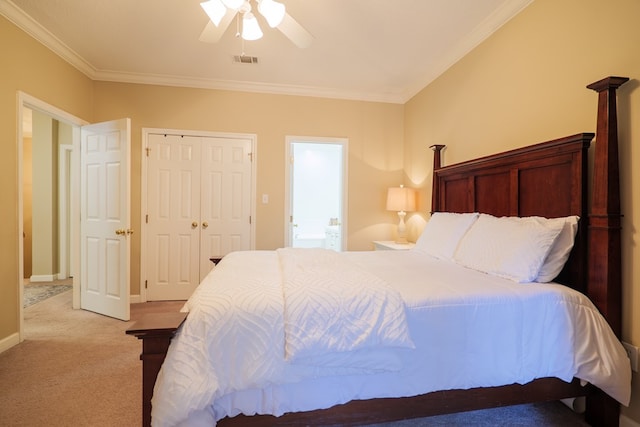 bedroom with ceiling fan, a closet, light colored carpet, and ornamental molding