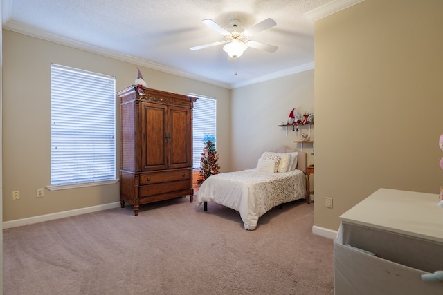 bedroom featuring a textured ceiling, ceiling fan, light colored carpet, and crown molding