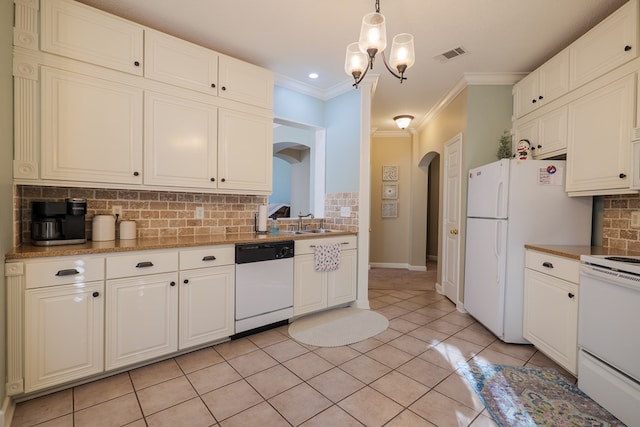 kitchen featuring pendant lighting, white appliances, sink, ornamental molding, and tasteful backsplash