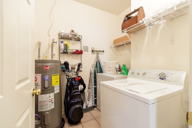 laundry room with independent washer and dryer, light tile patterned floors, and water heater