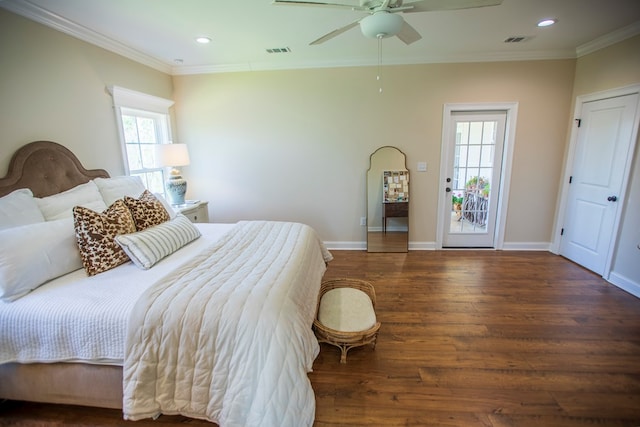 bedroom featuring crown molding, wood finished floors, and visible vents