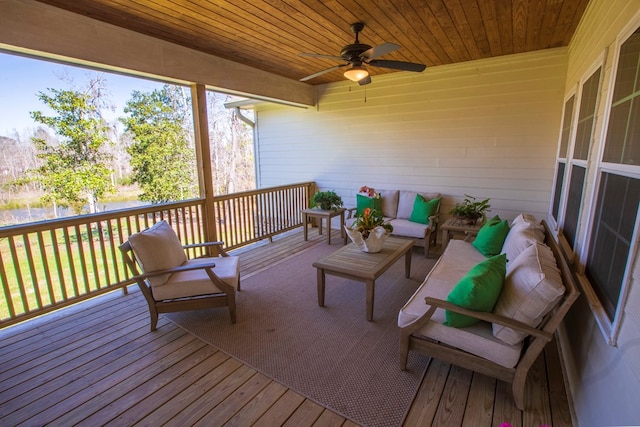 wooden terrace with outdoor lounge area and ceiling fan