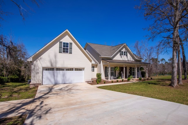 view of front of home with a garage, driveway, covered porch, and a front lawn