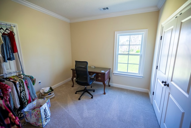 carpeted home office featuring visible vents, baseboards, and ornamental molding