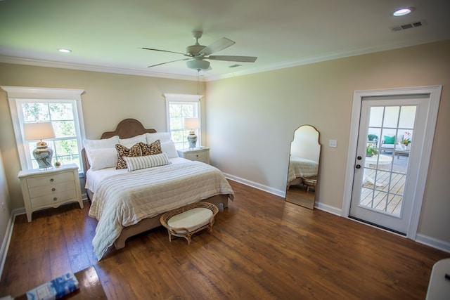 bedroom with a ceiling fan, baseboards, visible vents, wood-type flooring, and crown molding