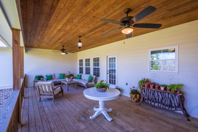 deck featuring ceiling fan and an outdoor hangout area