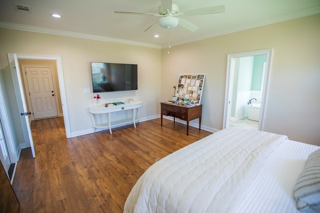 bedroom featuring visible vents, baseboards, wood finished floors, and crown molding