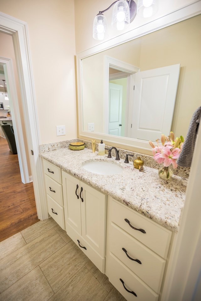 bathroom featuring vanity and wood finished floors