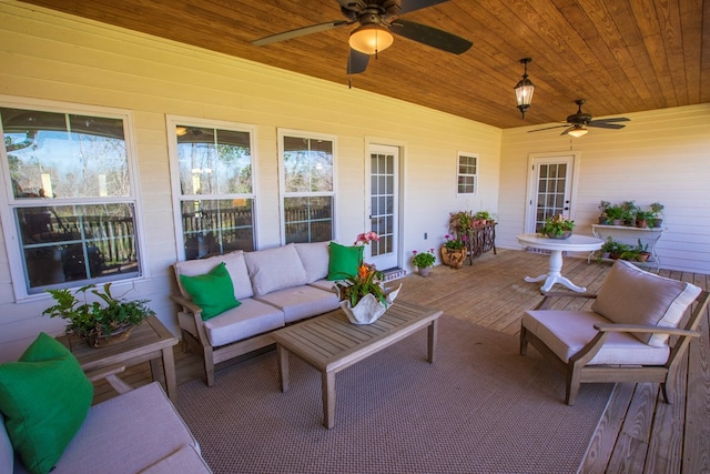 view of patio / terrace featuring an outdoor living space, a ceiling fan, and a wooden deck