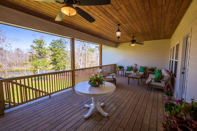 deck featuring an outdoor living space and a ceiling fan