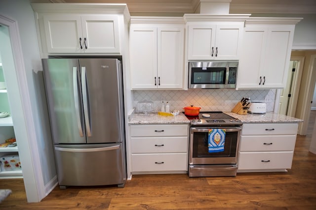 kitchen featuring dark wood finished floors, light stone counters, white cabinetry, and stainless steel appliances