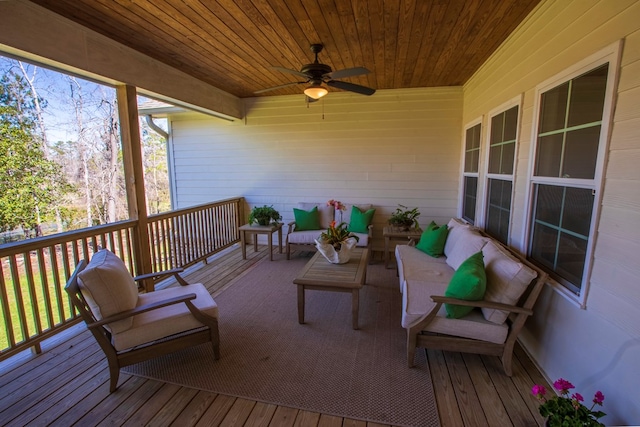 deck with an outdoor living space and ceiling fan