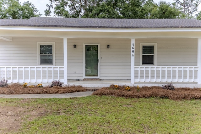 4604 Pinebrook Dr, Lake Park, GA 31636 - doorway to property with a porch, roof with shingles, and a lawn