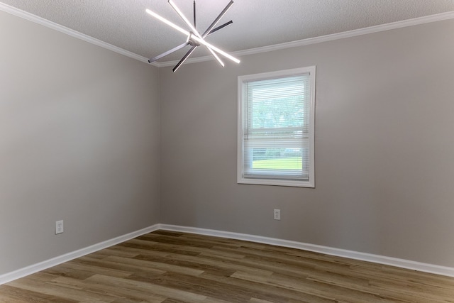 4604 Pinebrook Dr, Lake Park, GA 31636 - spare room with wood finished floors, ornamental molding, a textured ceiling, and a chandelier