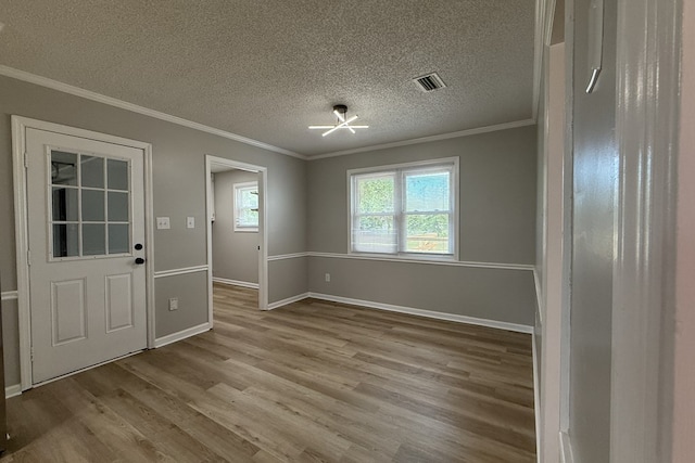 4604 Pinebrook Dr, Lake Park, GA 31636 - unfurnished dining area featuring ornamental molding, wood finished floors, and a textured ceiling