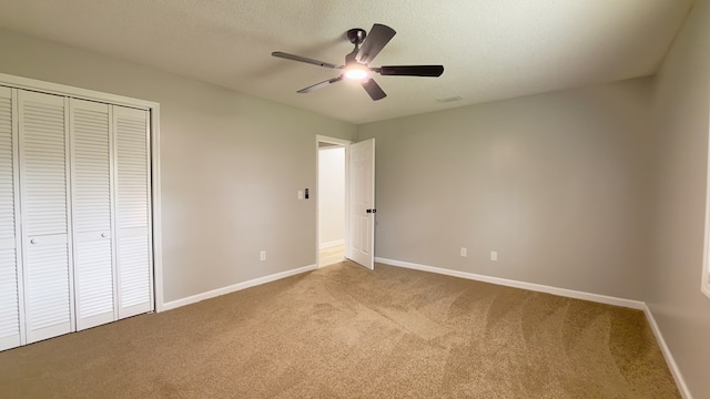 4604 Pinebrook Dr, Lake Park, GA 31636 - unfurnished bedroom featuring carpet, a closet, a ceiling fan, and a textured ceiling