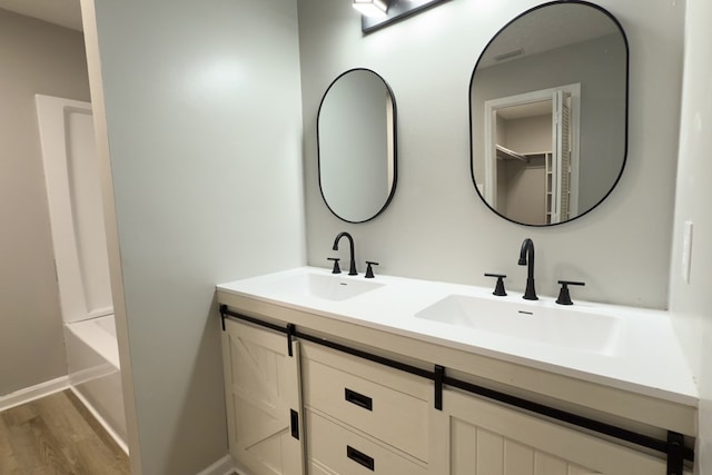 4604 Pinebrook Dr, Lake Park, GA 31636 - full bathroom featuring double vanity and wood finished floors