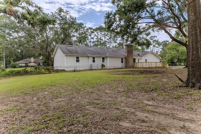 4604 Pinebrook Dr, Lake Park, GA 31636 - back of house with a chimney and a wooden deck