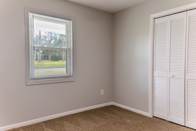 4604 Pinebrook Dr, Lake Park, GA 31636 - unfurnished bedroom featuring carpet flooring, multiple windows, and a closet