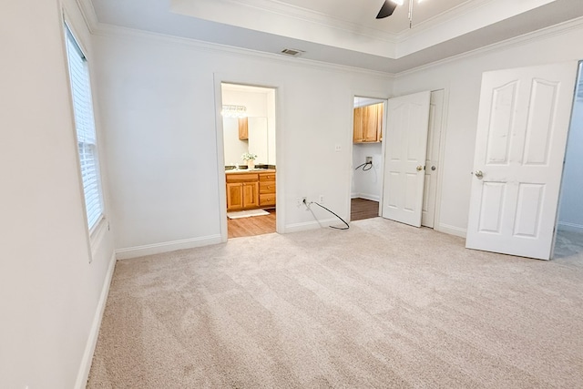 17 Ard Rd, Ray City, GA 31645 - unfurnished bedroom with a raised ceiling, light colored carpet, crown molding, baseboards, and connected bathroom