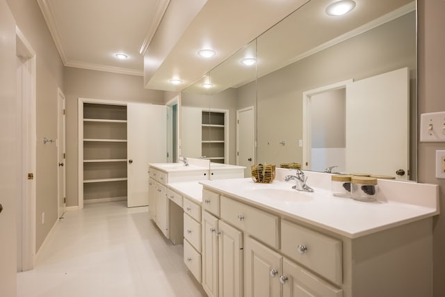 bathroom with tile patterned flooring, built in shelves, vanity, and crown molding