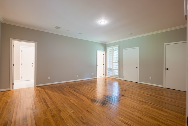 unfurnished room with light hardwood / wood-style floors and ornamental molding