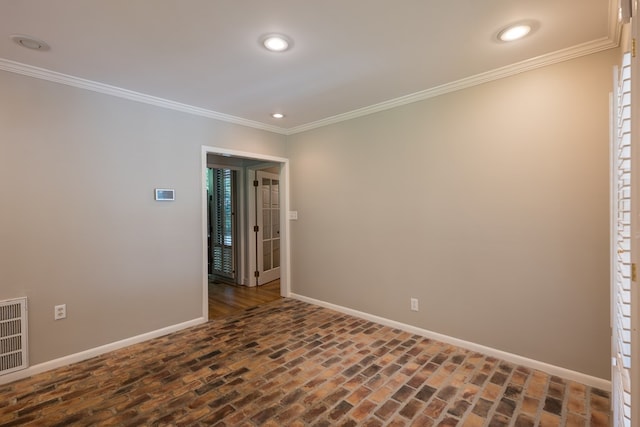 spare room with crown molding