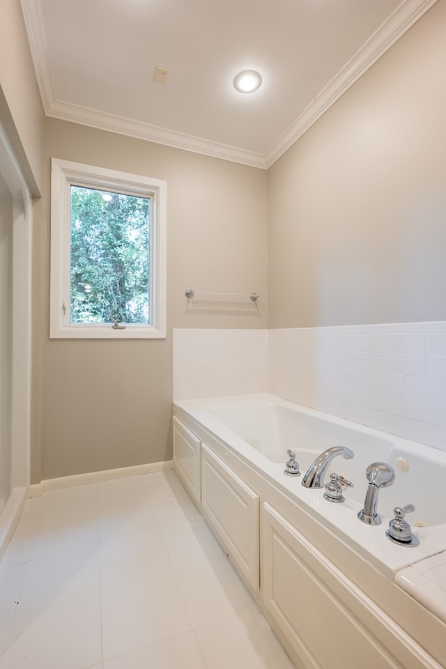 bathroom featuring tile patterned floors, a tub, and crown molding