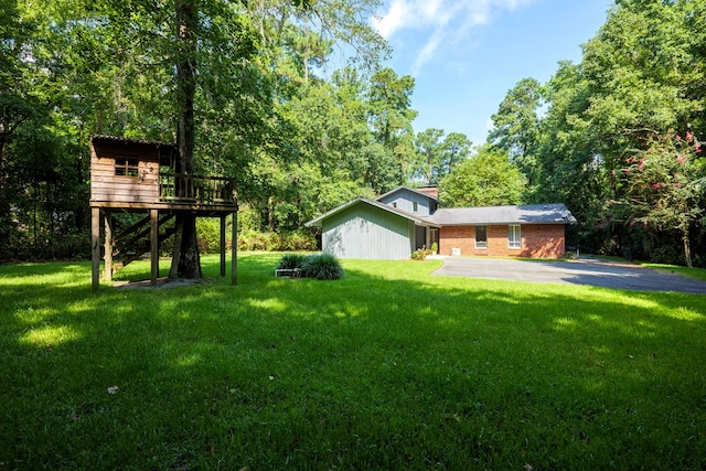 view of yard featuring a wooden deck