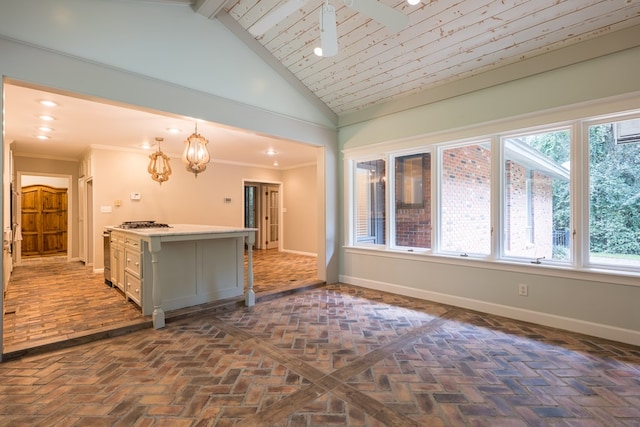 kitchen featuring a center island, high vaulted ceiling, pendant lighting, a breakfast bar, and ornamental molding