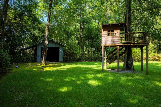 view of yard featuring a shed and a deck