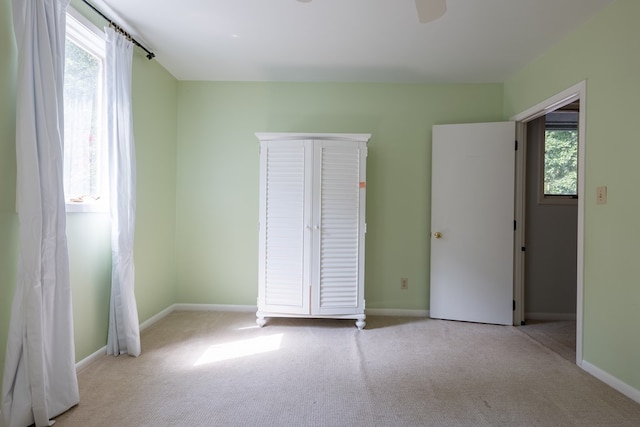 unfurnished bedroom with light carpet