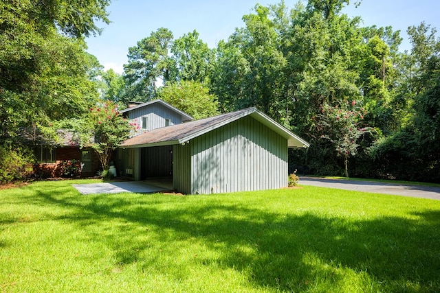 view of side of home featuring a lawn