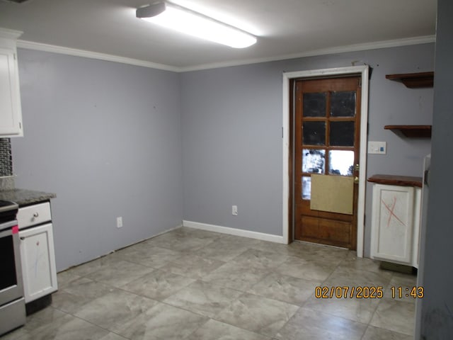 kitchen featuring ornamental molding and white cabinets