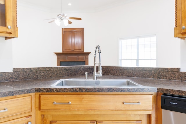 kitchen featuring dishwasher, ceiling fan, a sink, and crown molding