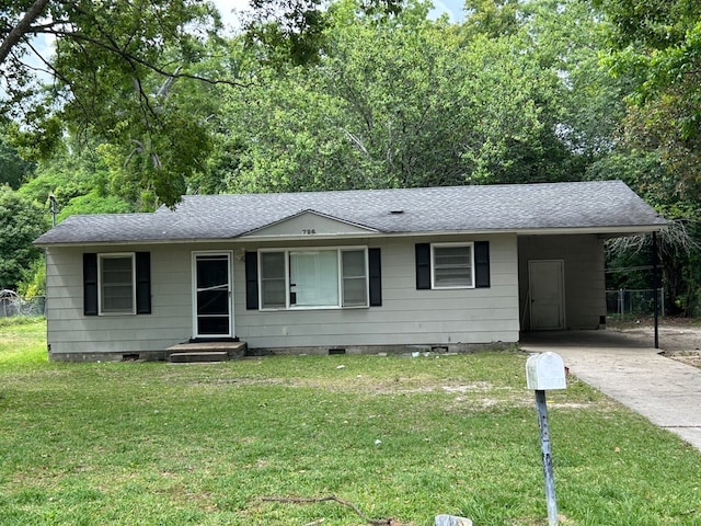 ranch-style house with a carport and a front lawn