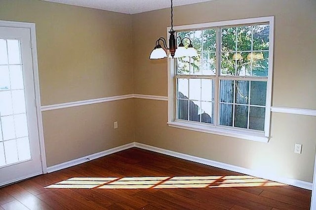 3802 Pondside Cir, Valdosta, GA 31605 - unfurnished dining area with a chandelier and hardwood / wood-style flooring
