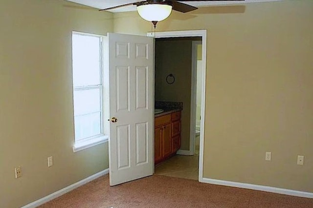 3802 Pondside Cir, Valdosta, GA 31605 - unfurnished bedroom with light carpet, multiple windows, and ensuite bath