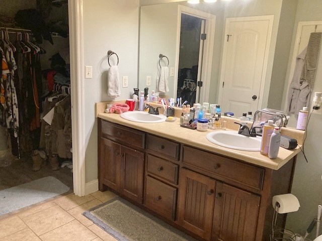 bathroom with tile patterned flooring and vanity