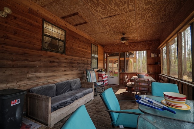 sunroom with ceiling fan and a wealth of natural light