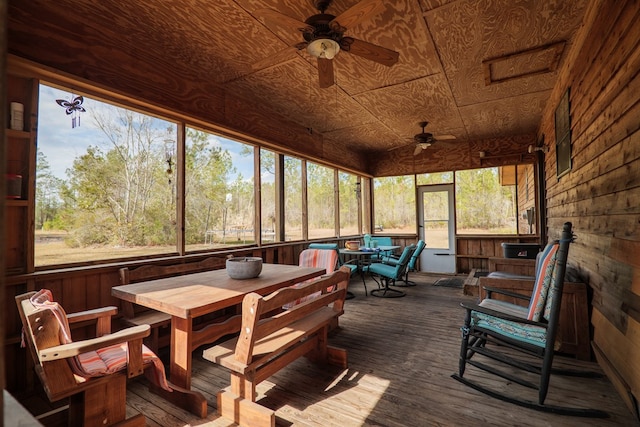 sunroom with wooden ceiling and ceiling fan