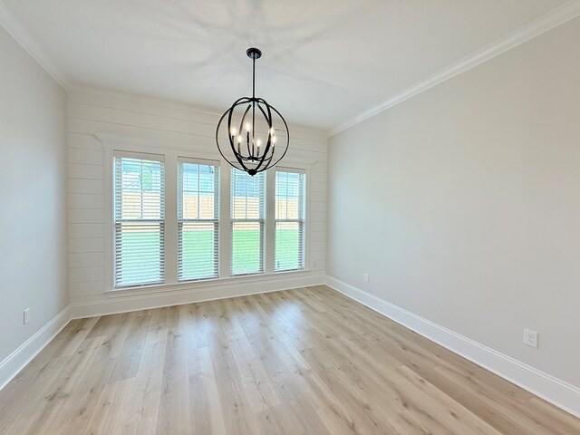 4965 Hatfield Cir, Hahira, GA 31632 - unfurnished dining area with a chandelier, crown molding, baseboards, and light wood-style floors
