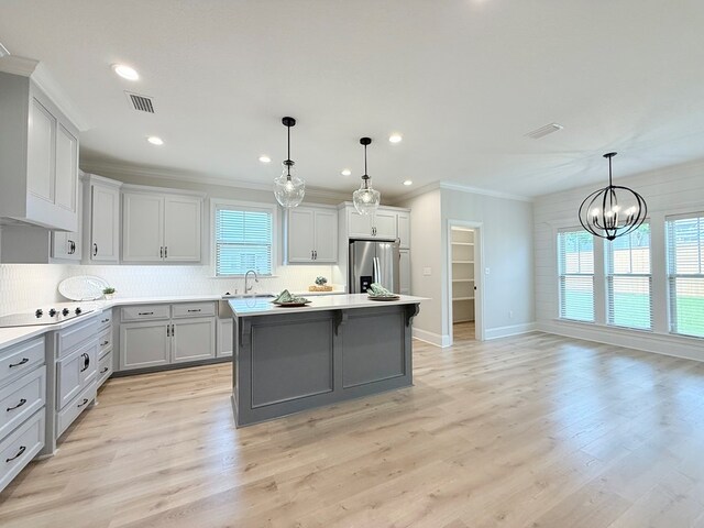 4965 Hatfield Cir, Hahira, GA 31632 - kitchen featuring stainless steel refrigerator with ice dispenser, a sink, gray cabinetry, a chandelier, and a kitchen island