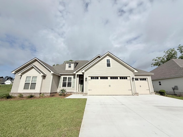 4965 Hatfield Cir, Hahira, GA 31632 - view of front of house featuring a garage, concrete driveway, a front lawn, and a shingled roof