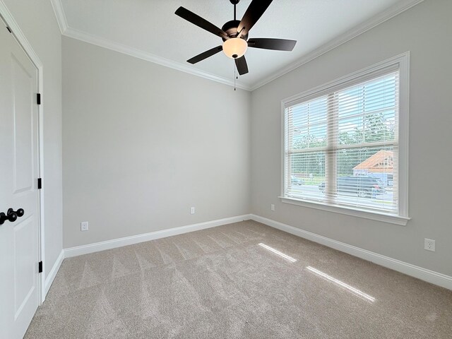 4965 Hatfield Cir, Hahira, GA 31632 - spare room with light colored carpet, ornamental molding, baseboards, and ceiling fan