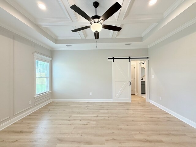 4965 Hatfield Cir, Hahira, GA 31632 - unfurnished room featuring coffered ceiling, ceiling fan, a barn door, light wood-style flooring, and beam ceiling