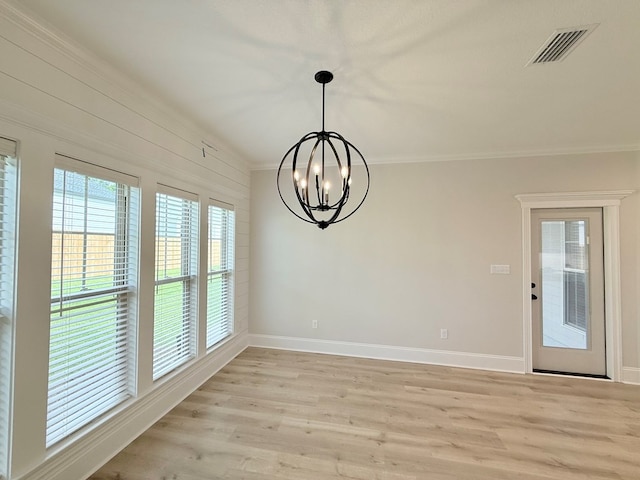 4965 Hatfield Cir, Hahira, GA 31632 - unfurnished dining area with a chandelier, baseboards, light wood-style floors, and crown molding