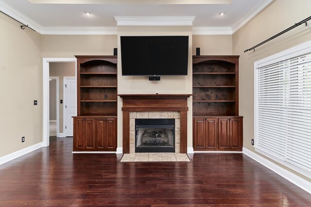 5527 School House Pond Rd, Lake Park, GA 31636 - unfurnished living room featuring dark wood-style floors, crown molding, a tile fireplace, and baseboards