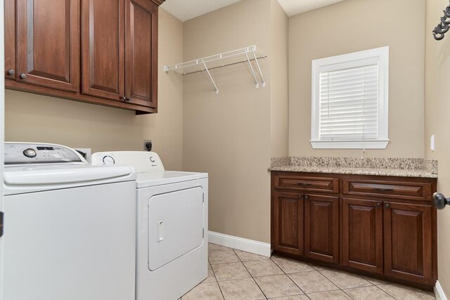 5527 School House Pond Rd, Lake Park, GA 31636 - laundry area featuring cabinet space, separate washer and dryer, light tile patterned flooring, and baseboards